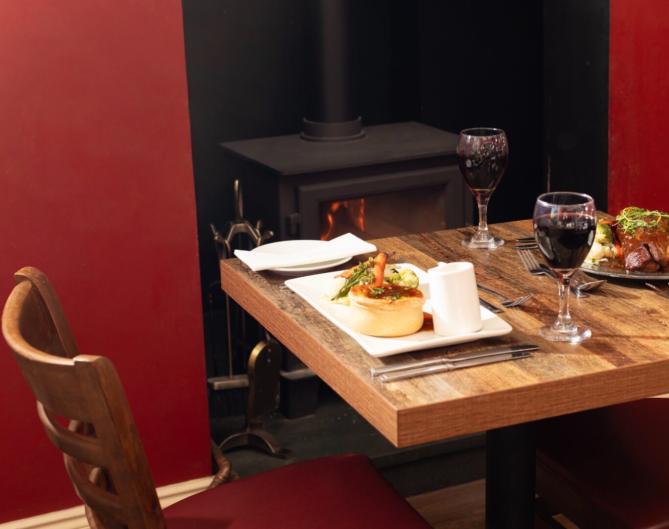 dinner in front of the fire, lake district castle inn hotel, bassenthwaite