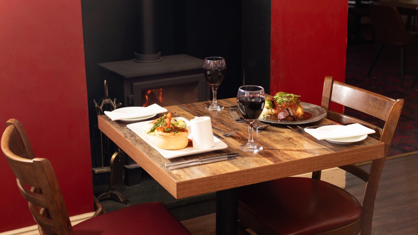 dinner in front of the fire, lake district castle inn hotel, bassenthwaite