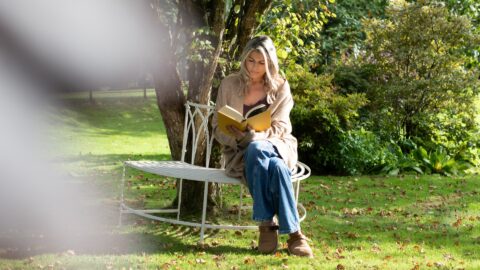reading in the garden, lake district castle inn hotel, bassenthwaite